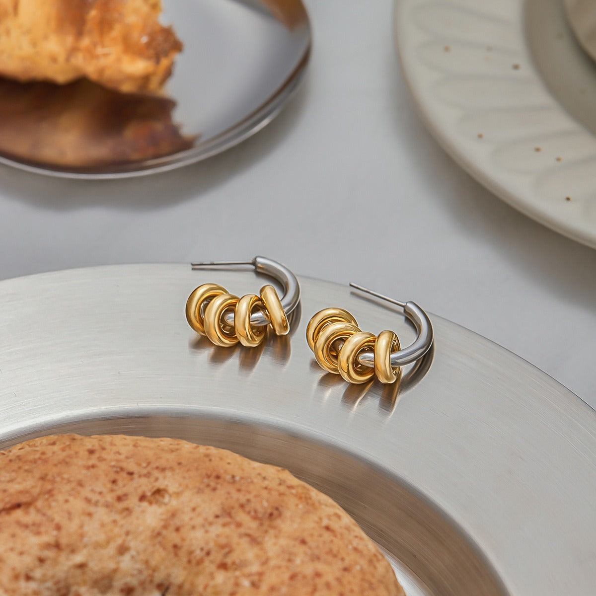 18K gold C-shaped earrings with a hoop design