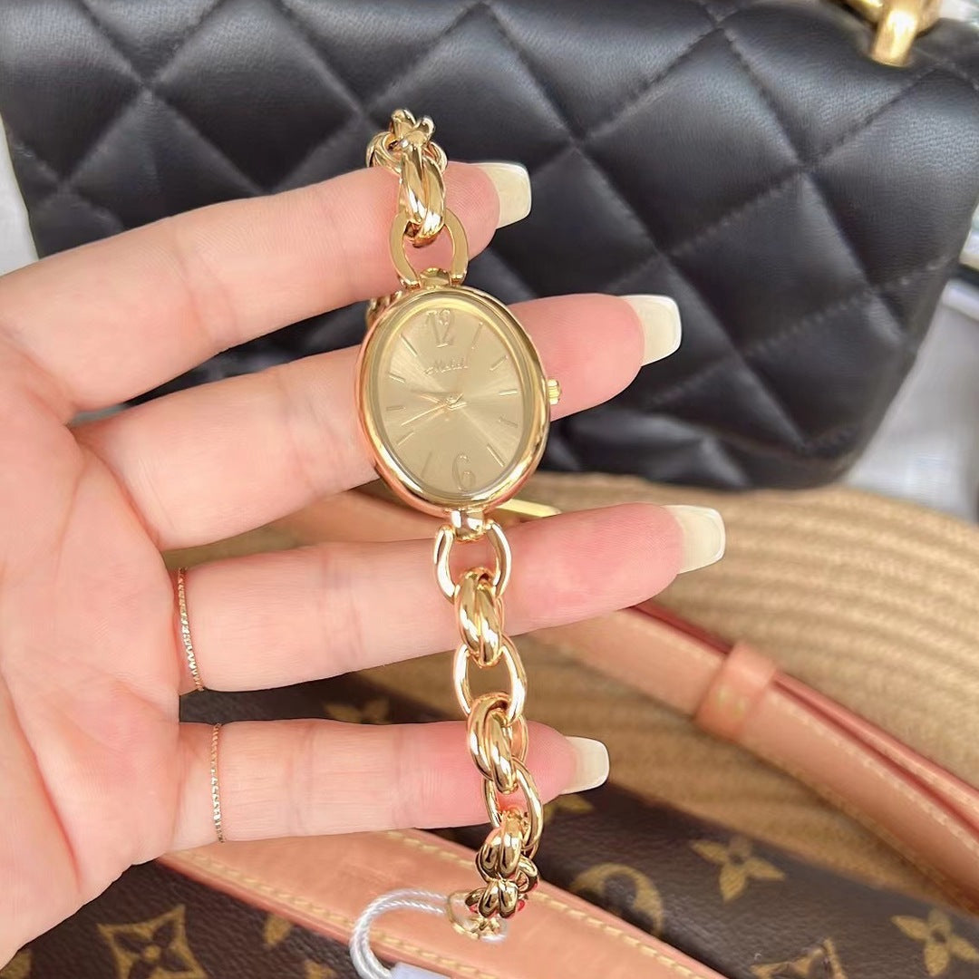 Lady's Steel Strap Watch Gold Oval Hollow Chain Quartz Watch