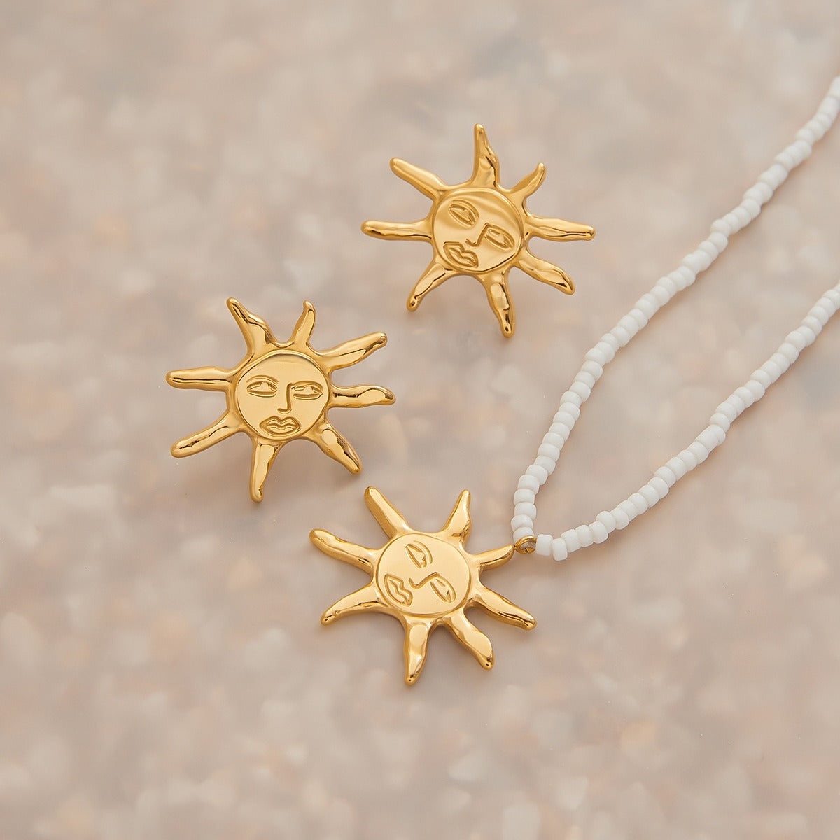 18K gold sun-shaped earrings and necklace set with exaggerated facial features