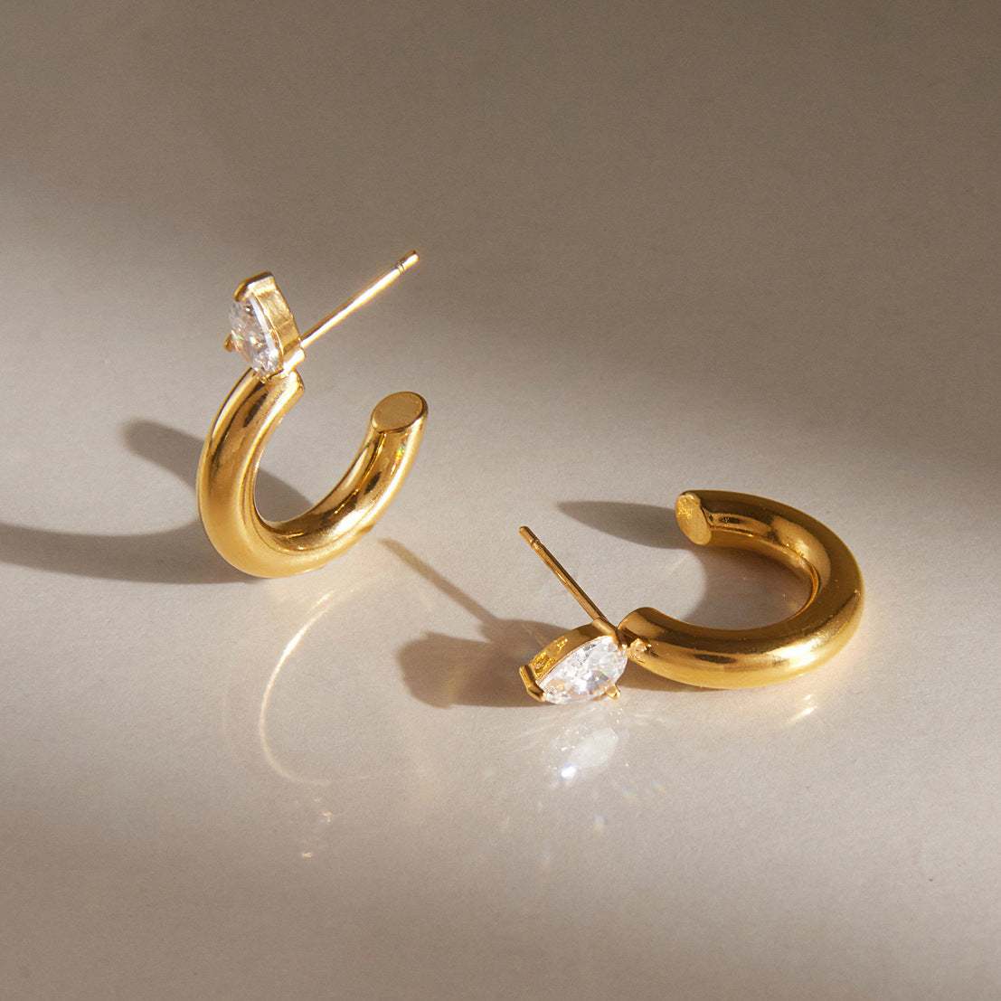 Twisted Zircon Huggie Earrings