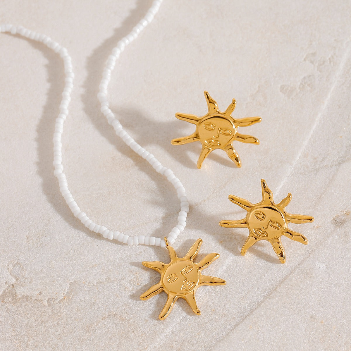 18K gold sun-shaped earrings and necklace set with exaggerated facial features