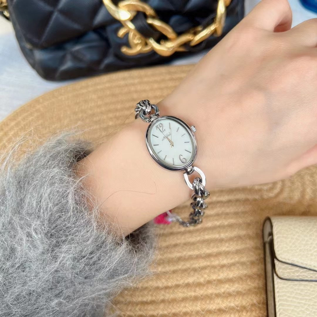 Lady's Steel Strap Watch Gold Oval Hollow Chain Quartz Watch