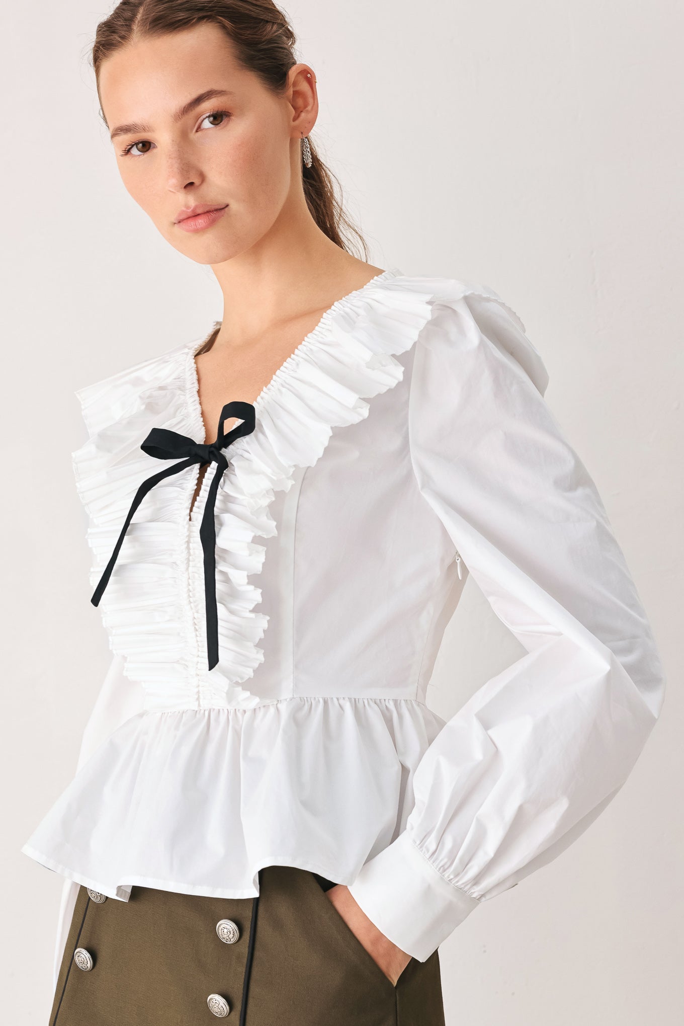 AMELIE PLEATED RUFFLE V-NECK WOVEN TOP