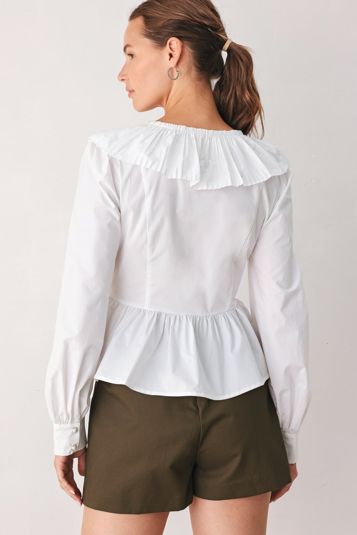 AMELIE PLEATED RUFFLE V-NECK WOVEN TOP