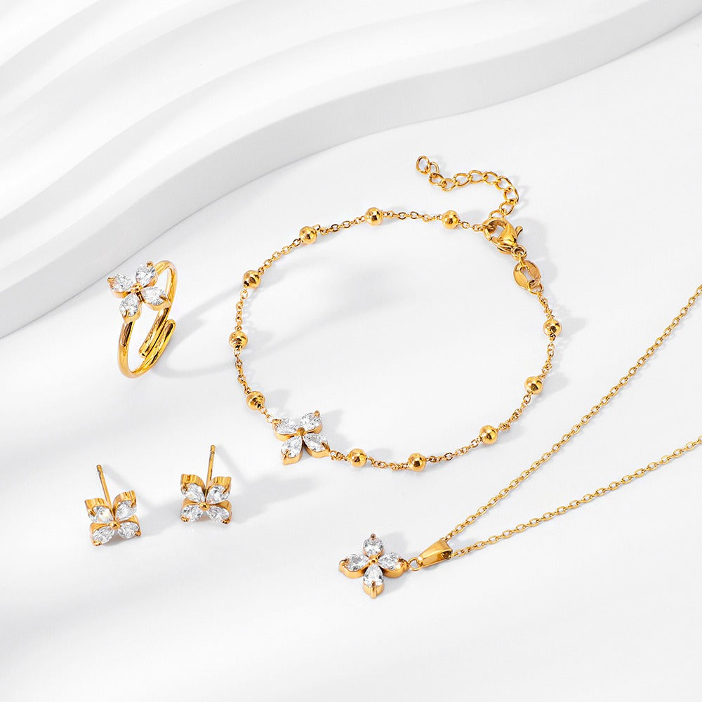 18K gold four-leaf flower inlaid with gemstones, exquisite and dazzling necklace, bracelet, earrings and ring set